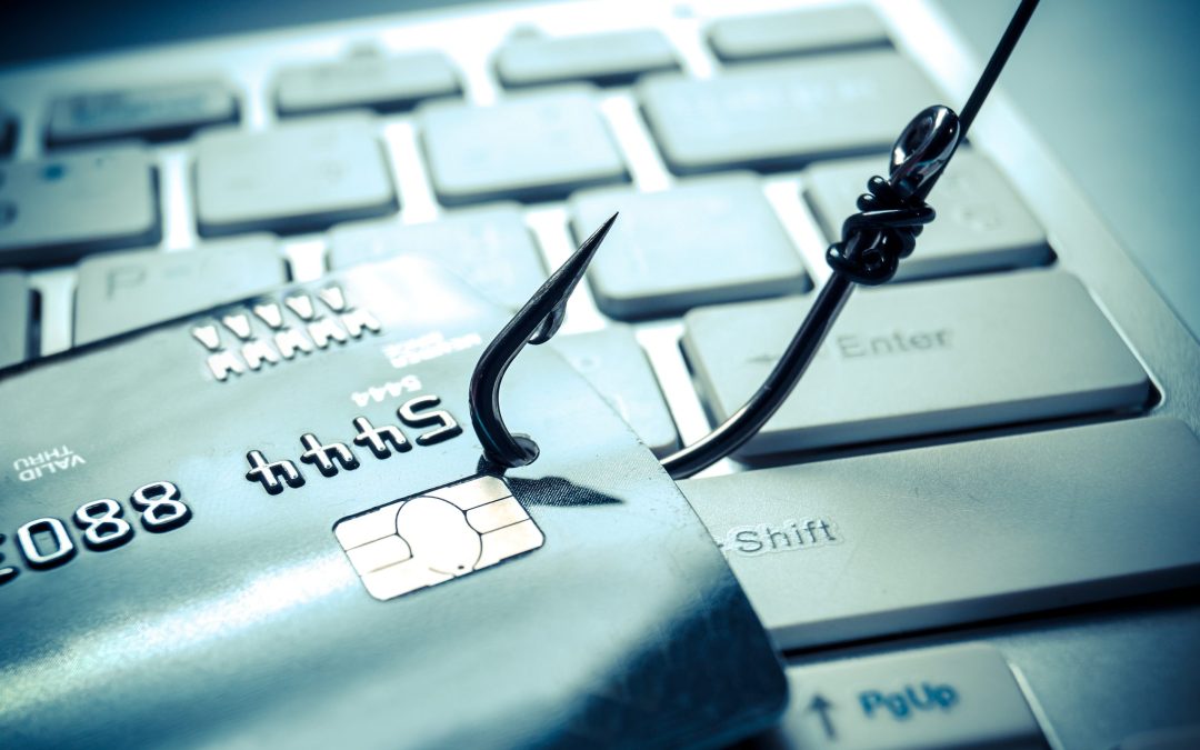 credit card phishing – piles of credit cards with a fish hook on