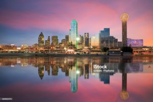Dallas skyline reflected in Trinity river at sunset, Texas
